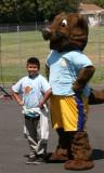 The FIRST 5 mascot with a young event attendee.